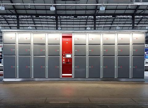 a large room with a large group of metal lockers